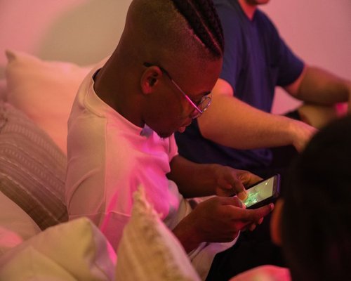 Smartphone showing a hotel and gaming weekend itinerary
